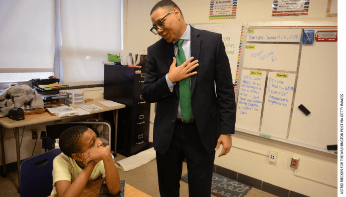 Lewis Ferebee (right), acting chancellor for D.C. Public Schools, talks to Taivian Scott, 12, while touring John Hayden Johnson Middle School in January 2019.