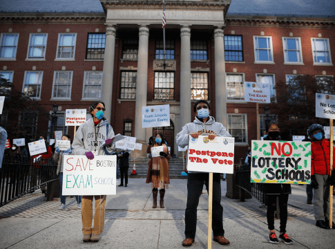 Protesters calling for Boston schools to keep the admissions exam in place for exam schools rally outside of Boston Latin School in Boston on October 18, 2020.