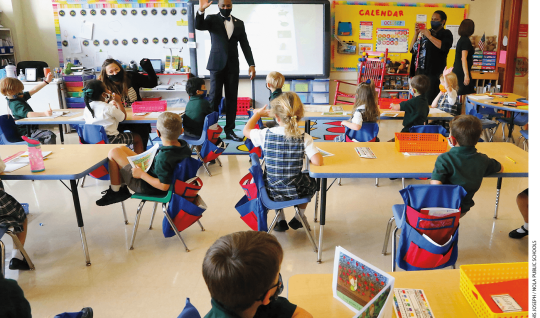 Superintendent Henderson Lewis Jr. stands in front of a class at Edward Hynes Charter School after the school resumed in-person learning in October 2020.