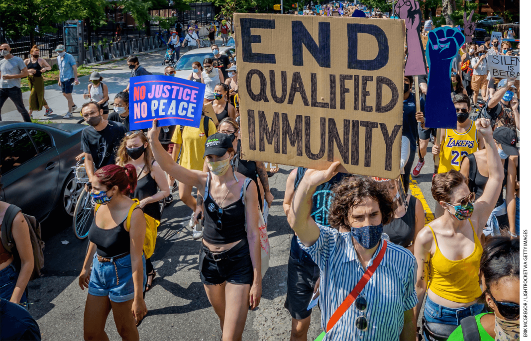 A protester holds an “END QUALIFIED IMMUNITY” sign during a Black Lives Matter protest in Brooklyn, New York, on July 4, 2020.
