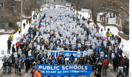 Teachers and supporters march from the MPS Nutrition Center to the John B. Davis Education Service Center during a rally in the first day of the teachers strike Tuesday, March 8, 2022. This is the city district's first teachers strike since 1970.
