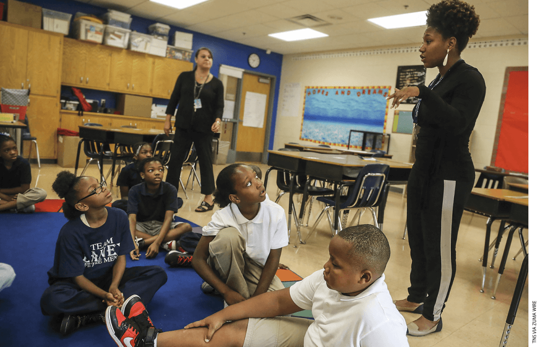 5th-grade math teachers Brittney Bentley and Nicole Plowman co-teach a multiplication lesson at Lucy Laney Community School in Minneapolis.