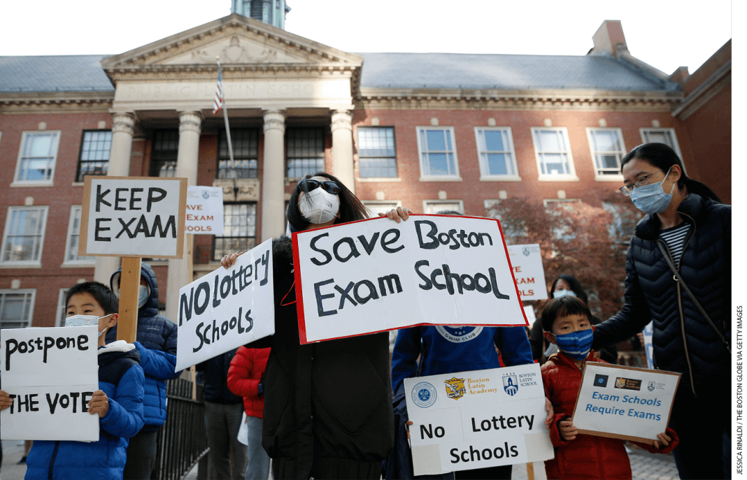 Protesters rally in favor of the Boston Latin School entrance exam in October 2021.