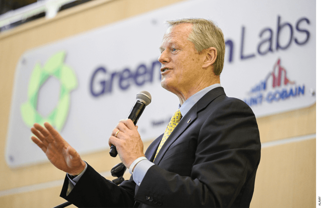 Photo of Charlie Baker speaking into a microphone