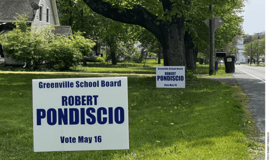Campaign signs for Robert Pondiscio on a lawn