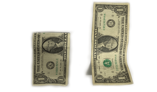 Two dollar bills on a white background
