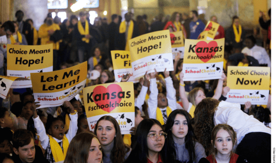 Private and home school students, their parents and advocates crowed part of the second floor of the Kansas Statehouse for a rally on education, Wednesday, Jan. 25, 2023, in Topeka, Kansas.